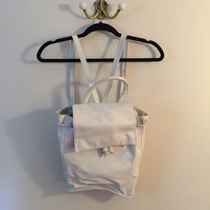 White faux leather back pack